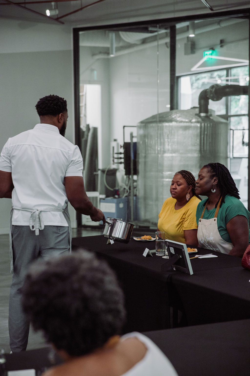 guests looking in chef Ponder's pot